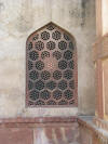 Window at Agra Fort in India. Agra Fort is listed as a UNESCO World Heritage Site. Agra Fort is also known as Lal Qila, Fort Rouge, and the Red Fort of Agra. Window at Agra Fort