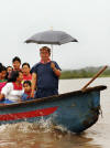Members of the Cofán indigenous community travel the once-pristine Aguarico River in the