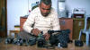 Co-director Emad Burnat with his five broken cameras. A Kino Lorber release.