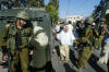 Emad's mother pleads with an Israeli soldier to release her son Khaled after he was arrested.