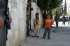 Co-director Emad Burnat with his family outside their home.  