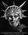 Ferlinghetti in a Statue of Liberty mask.