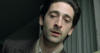 Adrien Brody as Wladyslaw Szpilman, hiding out in Warsaw, Poland, from the Nazis (The Pianist, 2002).