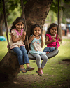 Little girls with a tree