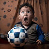 Petrified little boy with a soccer ball